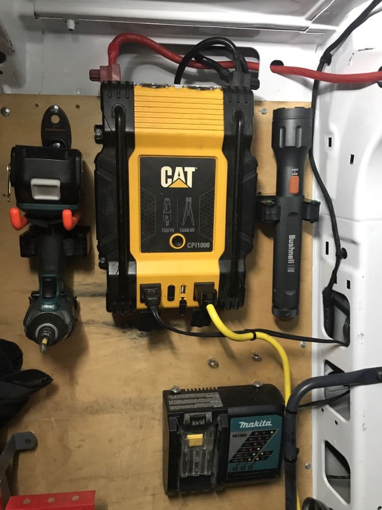 The organized tool wall inside a NextGen work van